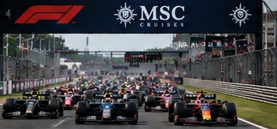 Formula racing field approaching the start of a Grand Prix on a fenced street-style circuit